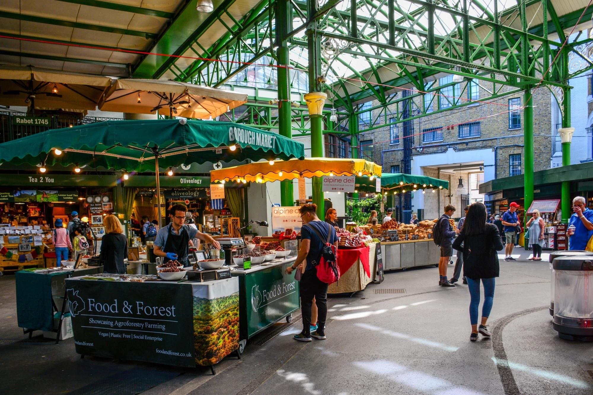Stalls under the green ironwork of Borough Market
